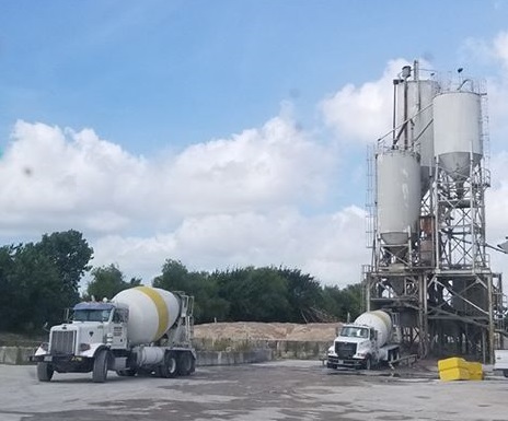 image of mixer trucks at concrete plant
